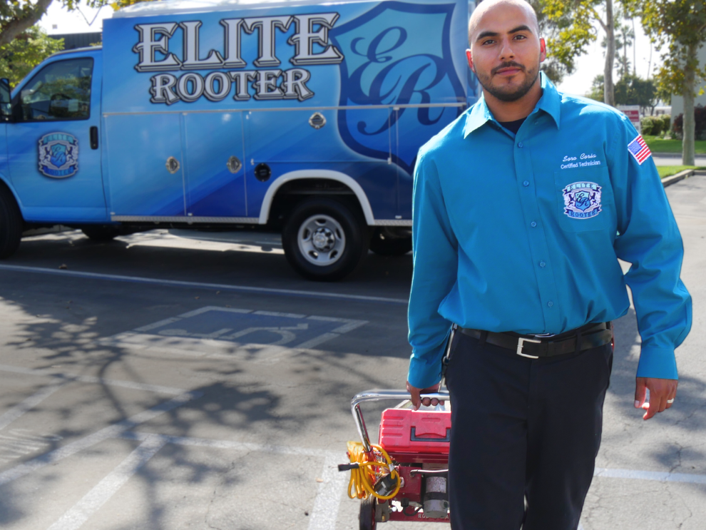 Elite Rooter Technician With A drain auger